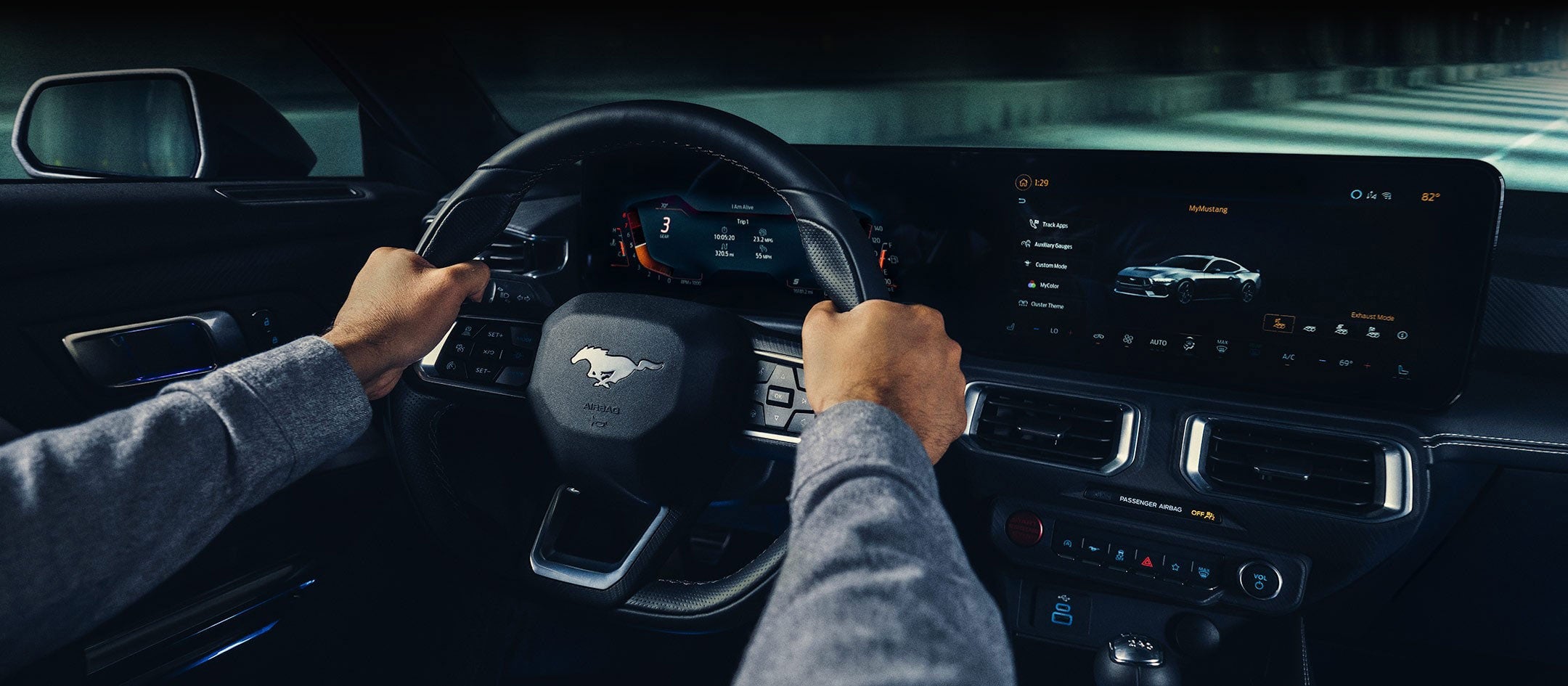 A 2024 Ford Mustang® model interior with a person driving | Pierre Ford of Prosser in Prosser WA